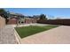 Backyard features artificial grass and a playground set at 10036 E Naranja Ave, Mesa, AZ 85209