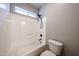 Clean, newly renovated bathroom with modern fixtures and a shower-tub combo at 10036 E Naranja Ave, Mesa, AZ 85209
