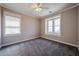 Bright bedroom features plush carpeting, fresh paint, and a large window allowing ample natural light at 10036 E Naranja Ave, Mesa, AZ 85209