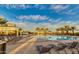 Expansive community pool with multiple lounge chairs and shaded cabanas, perfect for relaxation and socializing at 10036 E Naranja Ave, Mesa, AZ 85209