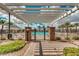 Inviting community pool area with a wrought iron fence, pool furniture, and ample gathering spaces at 10036 E Naranja Ave, Mesa, AZ 85209