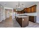 Kitchen with stainless steel appliances, granite countertops, a center island, and tile floors at 10036 E Naranja Ave, Mesa, AZ 85209