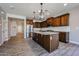 Kitchen with stainless steel appliances, granite countertops, a center island, and tile floors at 10036 E Naranja Ave, Mesa, AZ 85209