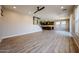 Open-concept living room with tile flooring that flows into the kitchen and dining area at 10036 E Naranja Ave, Mesa, AZ 85209