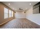 Bright living room area featuring tile floors, recessed lighting, and a ceiling fan at 10036 E Naranja Ave, Mesa, AZ 85209