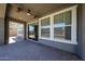 Covered patio features ceiling fans and views of the artificial lawn and backyard at 10036 E Naranja Ave, Mesa, AZ 85209
