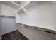 Walk-in closet with carpet flooring and many shelves and bars for optimal storage space at 10036 E Naranja Ave, Mesa, AZ 85209
