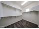 Spacious walk-in closet with carpet flooring and multiple shelves and bars for optimal storage at 10036 E Naranja Ave, Mesa, AZ 85209