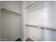 Clean walk-in closet with shelving, rods, and neutral paint at 10036 E Naranja Ave, Mesa, AZ 85209