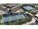 An aerial view of well-maintained community amenities including pickleball and tennis courts at 10348 E Tupelo Ave, Mesa, AZ 85212