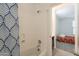 Bright bathroom area with a blue and white shower curtain, access to the vanity, and ample lighting at 10348 E Tupelo Ave, Mesa, AZ 85212