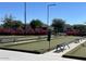 Bocce ball court equipped with park benches and meticulously maintained landscaping at 10348 E Tupelo Ave, Mesa, AZ 85212