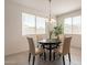 Cozy dining area bathed in natural light, featuring a round table and comfortable chairs at 10348 E Tupelo Ave, Mesa, AZ 85212