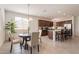 Bright dining area adjacent to kitchen, featuring modern lighting and a table with seating at 10348 E Tupelo Ave, Mesa, AZ 85212
