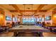 Elegant game room featuring billiard tables, comfortable seating, and stylish decor at 10348 E Tupelo Ave, Mesa, AZ 85212