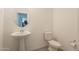 Clean, well-lit half bathroom with modern fixtures at 10348 E Tupelo Ave, Mesa, AZ 85212