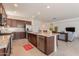 Open-concept kitchen with granite countertops, stainless steel appliances, and a spacious island at 10348 E Tupelo Ave, Mesa, AZ 85212