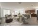 Bright open-concept living room with neutral colors, a view of the kitchen, and modern decor at 10348 E Tupelo Ave, Mesa, AZ 85212
