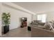 Comfortable living room area featuring tile flooring, a TV, and cozy seating at 10348 E Tupelo Ave, Mesa, AZ 85212