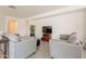 Inviting living room with a TV, neutral sofas, and a well-lit atmosphere at 10348 E Tupelo Ave, Mesa, AZ 85212