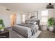 Comfortable and spacious primary bedroom with a queen-sized bed and neutral color tones at 10348 E Tupelo Ave, Mesa, AZ 85212