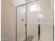 Bright bathroom shower with transparent glass door showing the clean interior at 10348 E Tupelo Ave, Mesa, AZ 85212