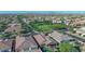 Expansive community with lush green space, a nearby walking path, and pools at 10650 E Palladium Dr, Mesa, AZ 85212