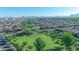 Spacious community with lush green spaces, walking paths, and stunning mountain views in the background at 10650 E Palladium Dr, Mesa, AZ 85212