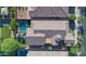 Stunning aerial shot of a home with a pool, covered patio, and well-manicured landscaping at 10650 E Palladium Dr, Mesa, AZ 85212
