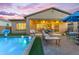 Inviting backyard oasis featuring a swimming pool, patio furniture, and grassy area for relaxation and entertainment at 10650 E Palladium Dr, Mesa, AZ 85212
