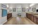 Bright bathroom showcasing wood cabinets, granite countertops, wood look flooring and dual mirrors at 10650 E Palladium Dr, Mesa, AZ 85212