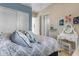 Bright bedroom with comfortable bed, white vanity, and closet, creating a cozy and functional space at 10650 E Palladium Dr, Mesa, AZ 85212