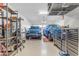 Spacious garage with epoxy floors, storage, and vehicles at 10650 E Palladium Dr, Mesa, AZ 85212