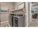 Well-appointed laundry room with modern washer and dryer at 10650 E Palladium Dr, Mesa, AZ 85212