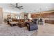 Bright and open concept living room flowing to kitchen featuring stylish furnishings, lighting, and finishes at 10650 E Palladium Dr, Mesa, AZ 85212