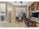 Well-appointed home office with hardwood floors, custom built-in shelving, and large windows at 10650 E Palladium Dr, Mesa, AZ 85212