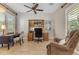 Home office featuring hardwood floors, built-in shelves, and a comfortable chair, creating an ideal workspace at 10650 E Palladium Dr, Mesa, AZ 85212