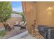 Cozy covered patio featuring comfortable seating, providing an inviting outdoor space for relaxation and entertaining at 10650 E Palladium Dr, Mesa, AZ 85212
