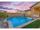 Stunning pool with water fountains and a basketball hoop, creating a fun and relaxing outdoor space at 10650 E Palladium Dr, Mesa, AZ 85212