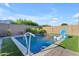 Inviting backyard pool with lush landscaping and sports equipment at 10650 E Palladium Dr, Mesa, AZ 85212