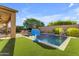 Inviting backyard oasis featuring a sparkling pool, fountain features, and an outdoor seating area for relaxing and entertaining at 10650 E Palladium Dr, Mesa, AZ 85212