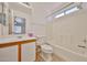 Bright bathroom with tub and shower combination, single sink vanity, and tile flooring at 12117 N 127Th Dr, El Mirage, AZ 85335