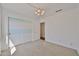Bedroom featuring carpet, neutral paint, and slider closet door at 12117 N 127Th Dr, El Mirage, AZ 85335