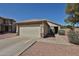 Charming single-story home featuring a two-car garage and neutral-colored exterior, enhanced by a well-maintained yard at 12117 N 127Th Dr, El Mirage, AZ 85335