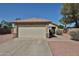 Charming single-story home featuring a two-car garage and neutral-colored exterior, enhanced by a well-maintained yard at 12117 N 127Th Dr, El Mirage, AZ 85335