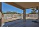 Covered patio offers a view of the fenced pool area with lounge chairs and desert landscaping at 12117 N 127Th Dr, El Mirage, AZ 85335