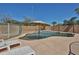 Inviting backyard pool features a waterfall feature, lounge chairs, and mature landscaping at 12117 N 127Th Dr, El Mirage, AZ 85335