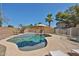 Backyard swimming pool with a waterfall feature, mature palms, and an umbrella for shade at 12117 N 127Th Dr, El Mirage, AZ 85335
