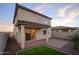 A rear exterior showing patio, turf, and exterior materials at 13244 N 146Th Ln, Surprise, AZ 85379