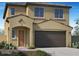Charming two-story home showcasing a desert-landscaped front yard and a spacious two-car garage at 13244 N 146Th Ln, Surprise, AZ 85379